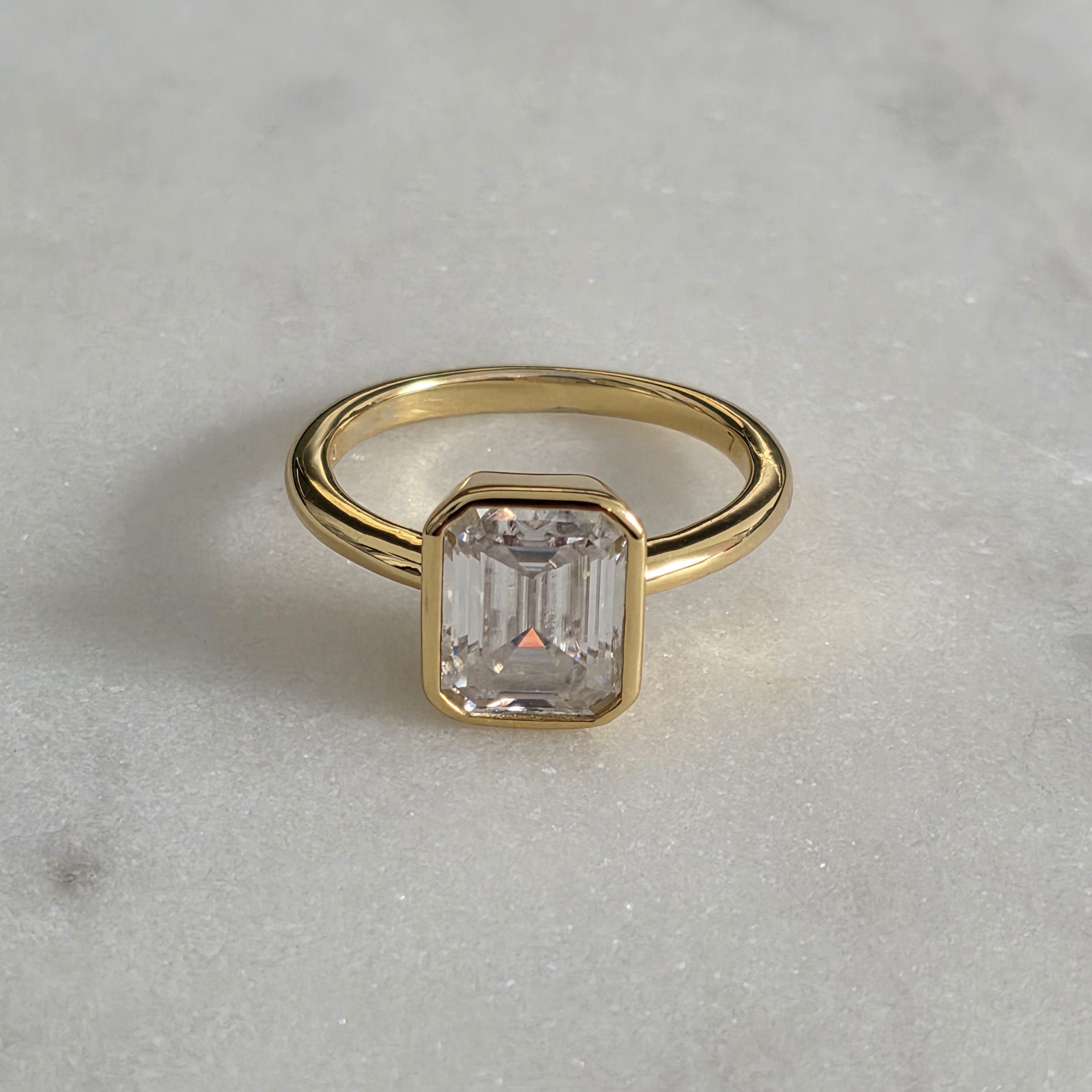 SOLITAIRE EMERALD-CUT BEZEL MOISSANITE RING - 3.0ct
