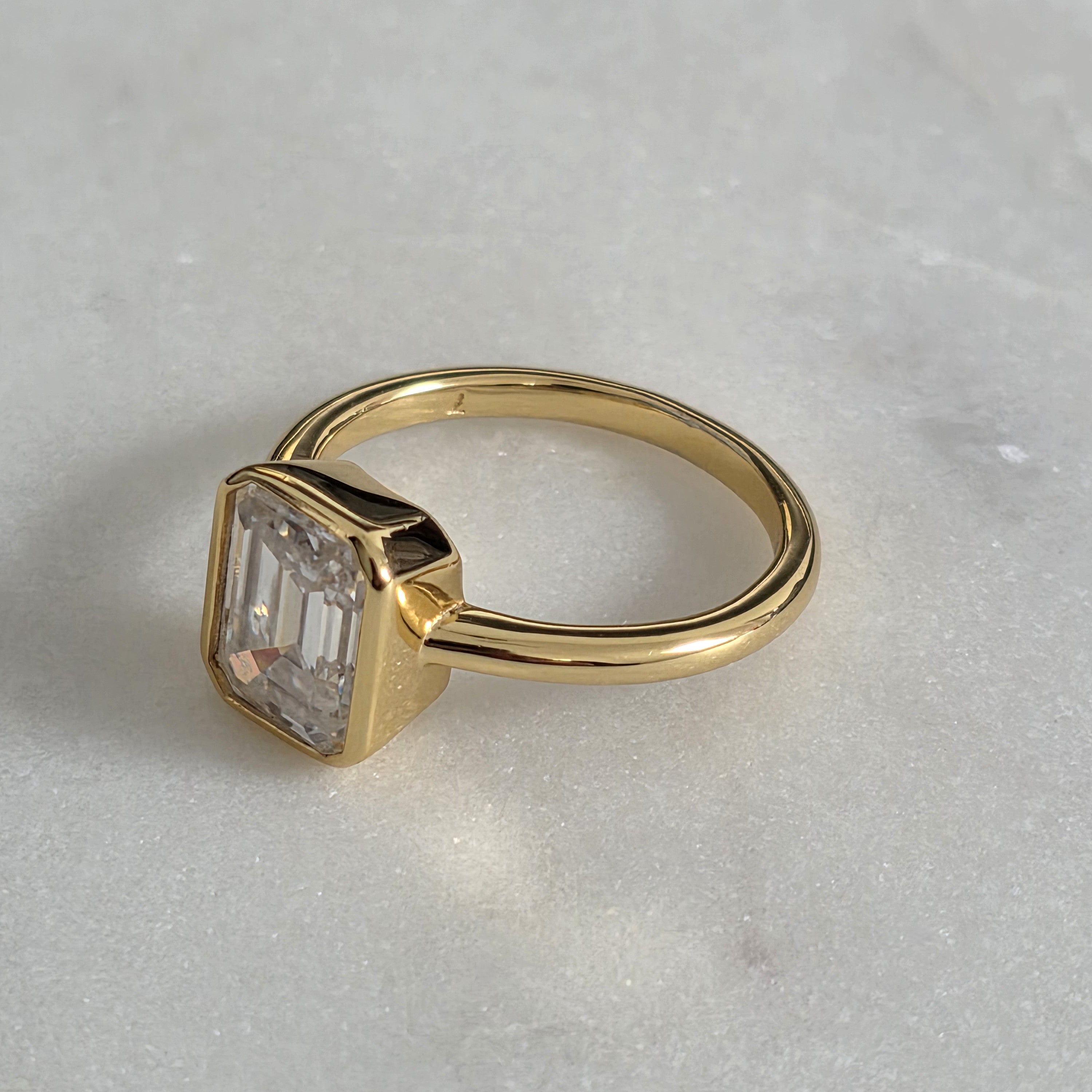 SOLITAIRE EMERALD-CUT BEZEL MOISSANITE RING - 3.0ct