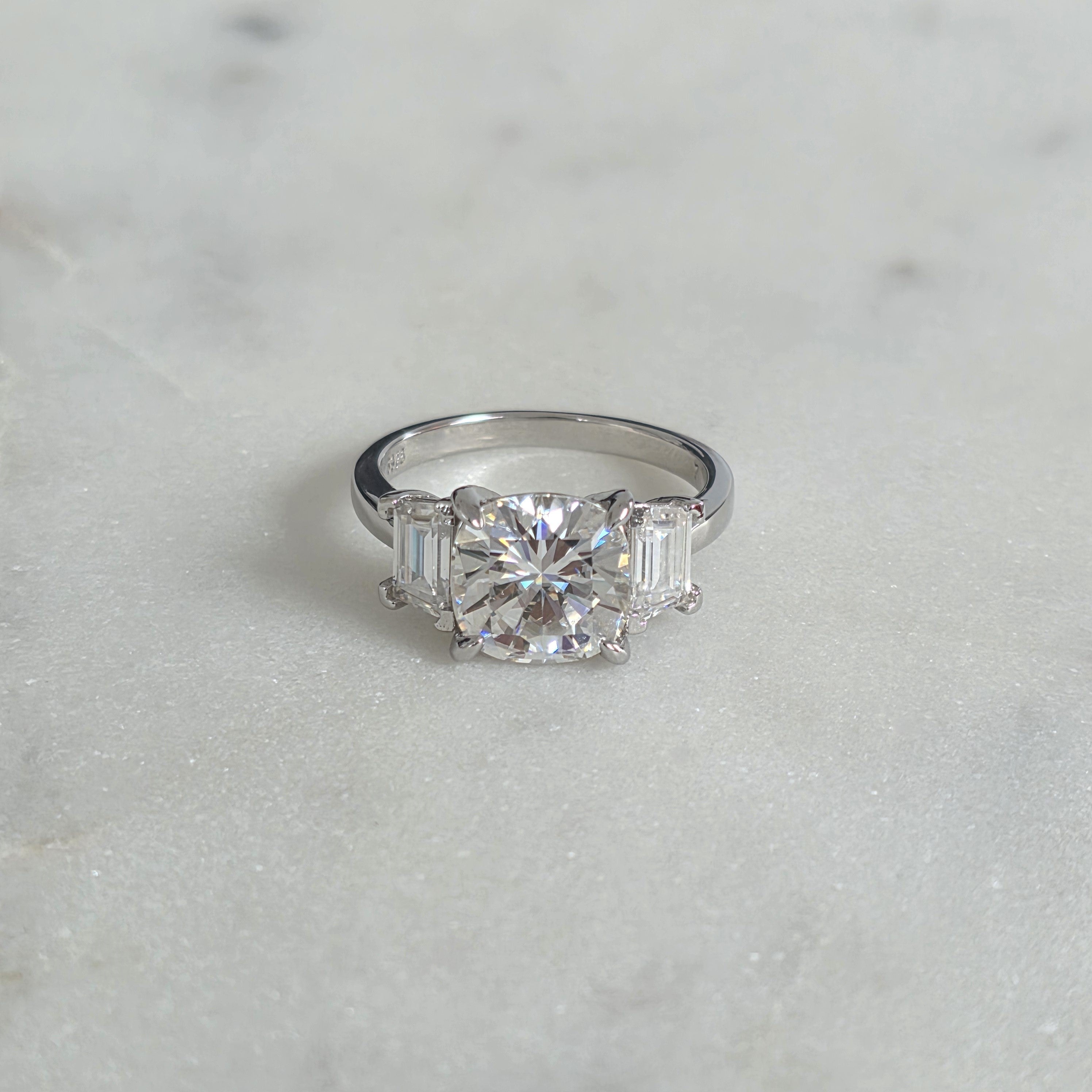 THREE-STONE CUSHION-CUT MOISSANITE RING - 4.63ct