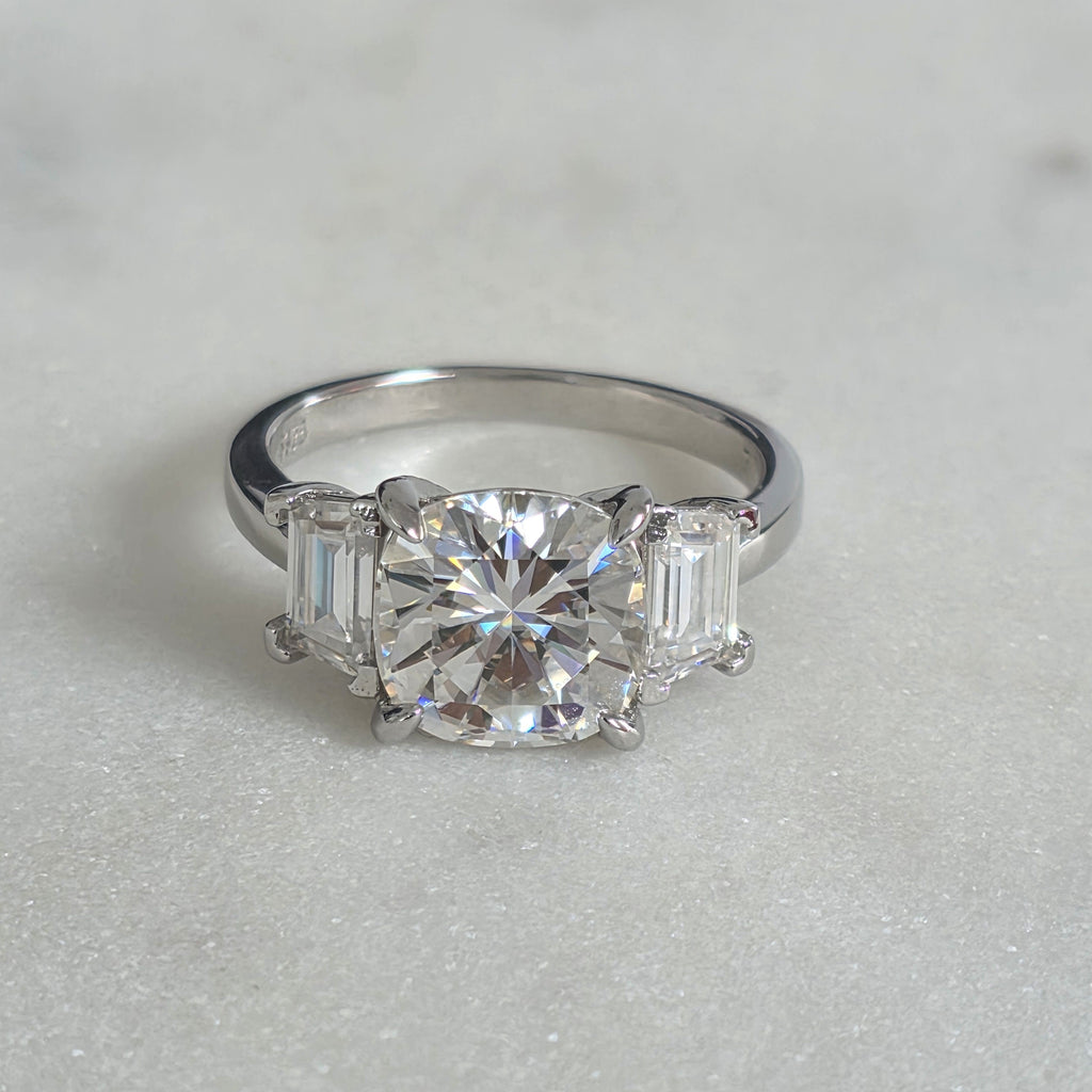 THREE-STONE CUSHION-CUT MOISSANITE RING - 4.63ct