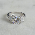 THREE-STONE CUSHION-CUT MOISSANITE RING - 4.63ct