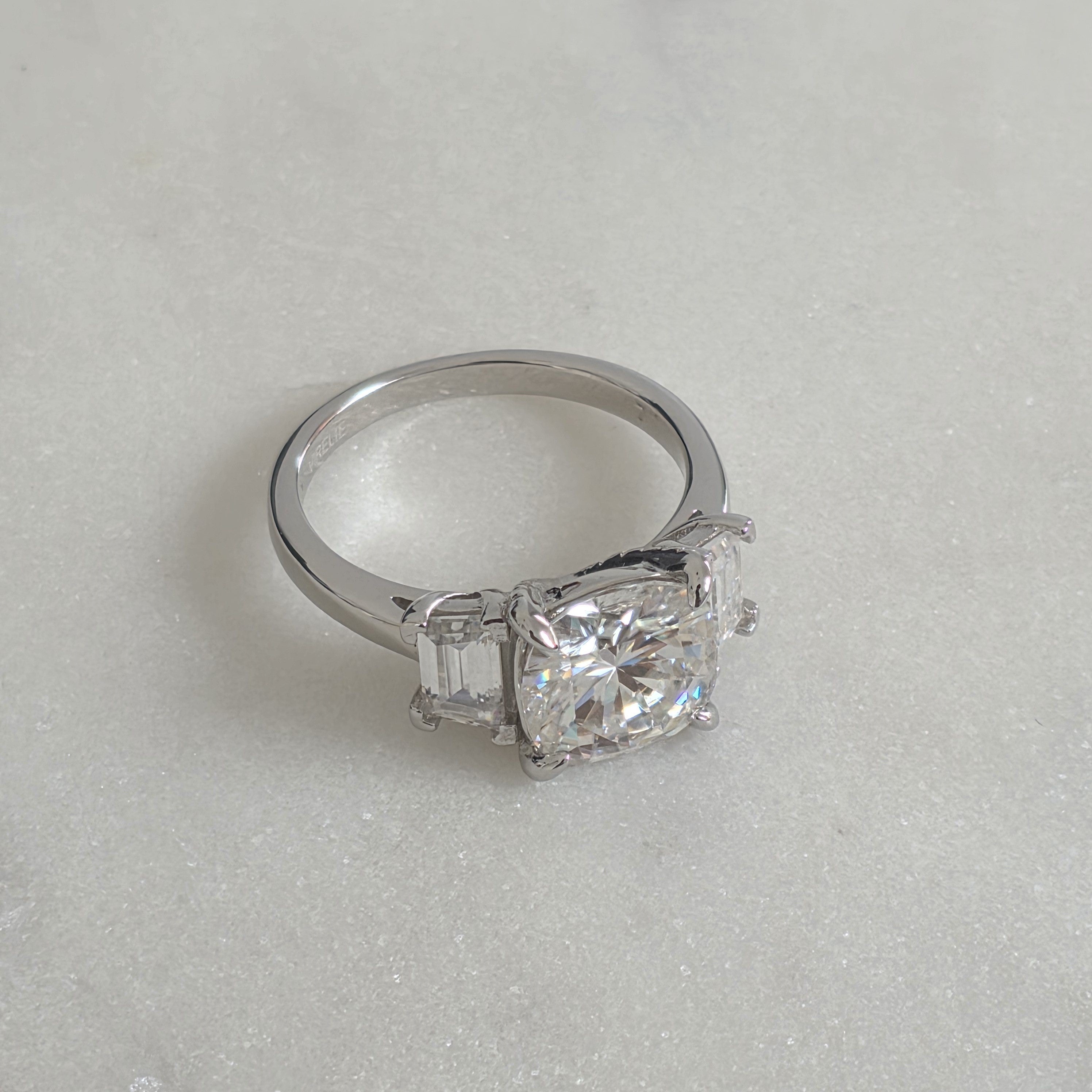 THREE-STONE CUSHION-CUT MOISSANITE RING - 4.63ct
