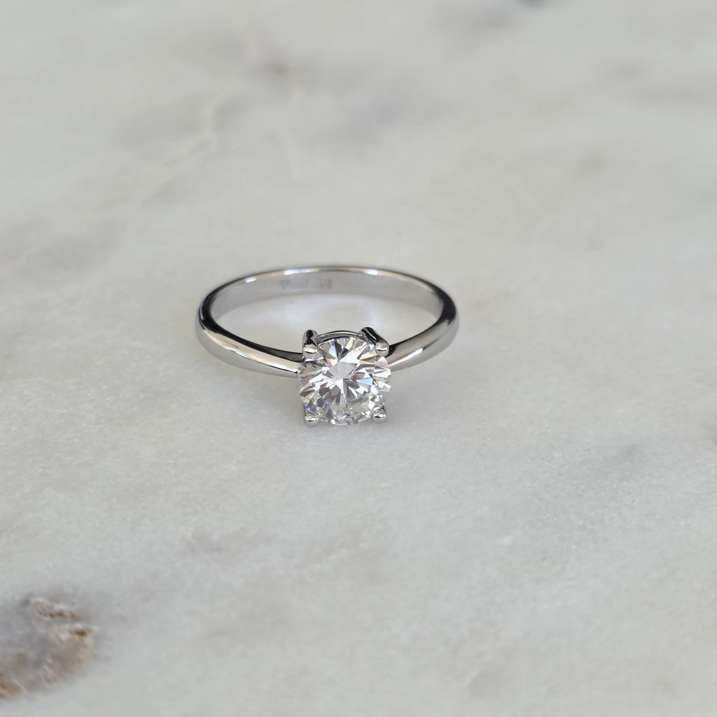 SOLITAIRE LOW PROFILE 4-PRONG ROUND-CUT MOISSANITE RING - 1.0ct
