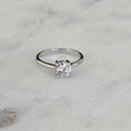 SOLITAIRE LOW PROFILE 4-PRONG ROUND-CUT MOISSANITE RING - 1.0ct
