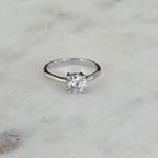 SOLITAIRE LOW PROFILE 4-PRONG ROUND-CUT MOISSANITE RING - 1.0ct