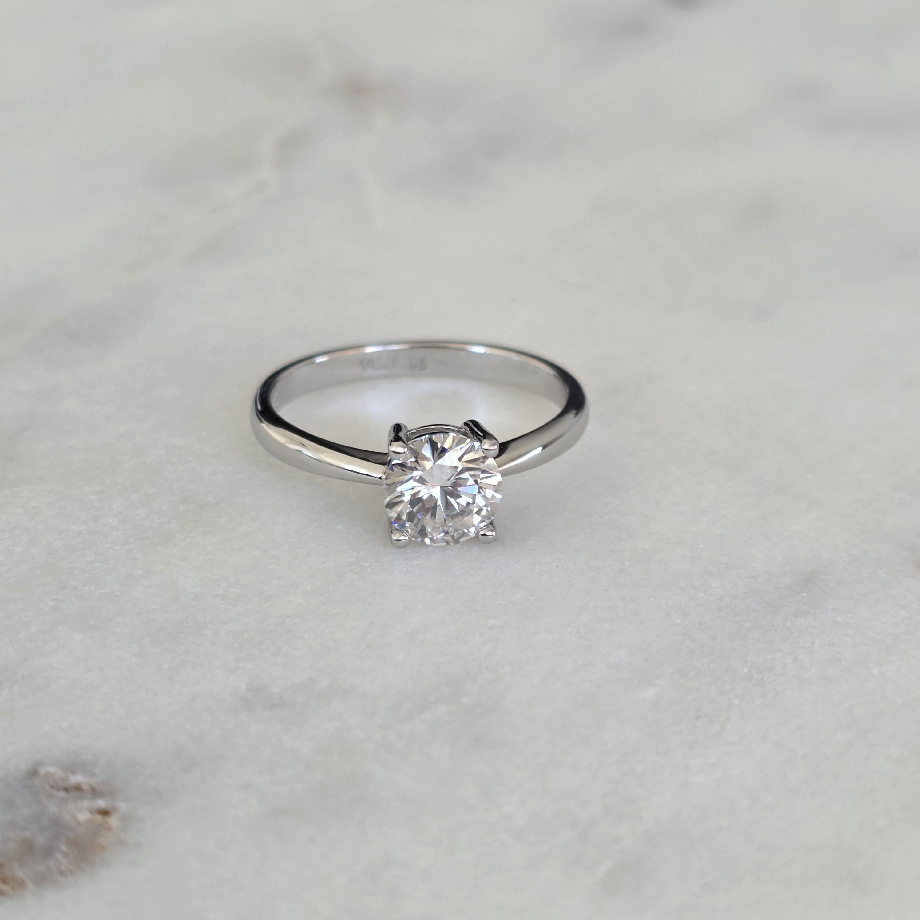 SOLITAIRE LOW PROFILE 4-PRONG ROUND-CUT MOISSANITE RING - 1.0ct