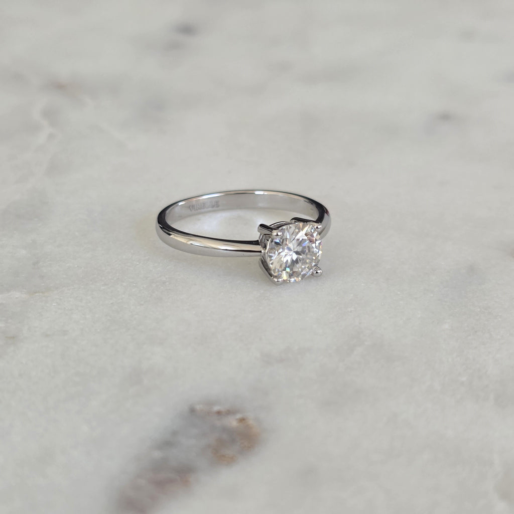 SOLITAIRE LOW PROFILE 4-PRONG ROUND-CUT MOISSANITE RING - 1.0ct