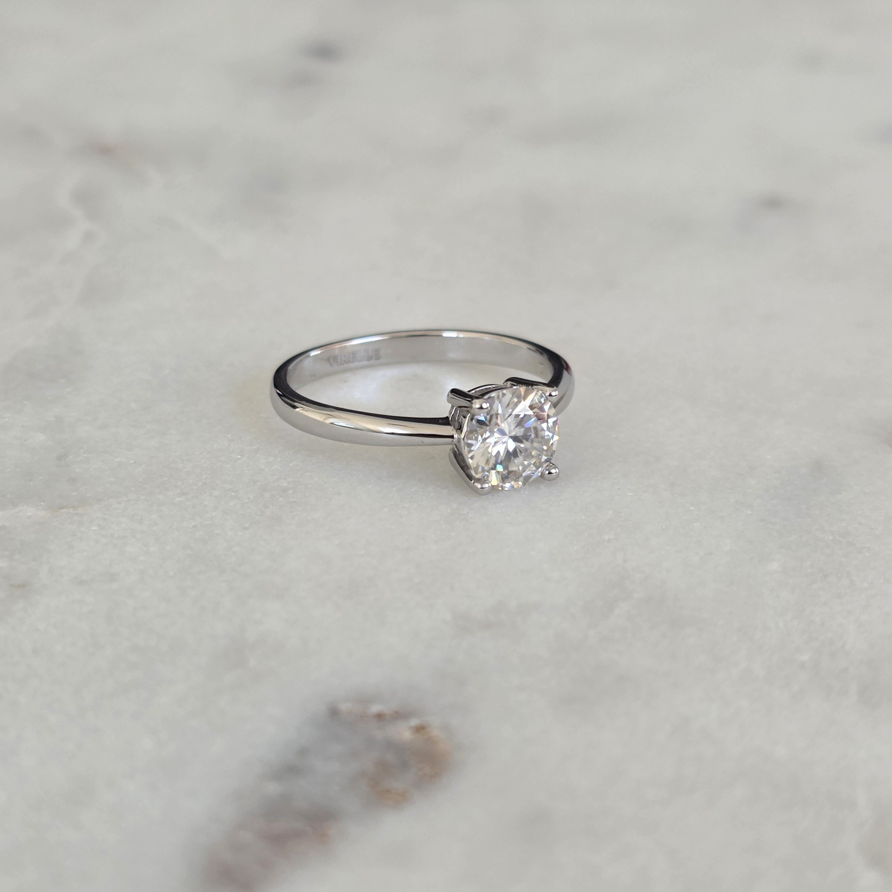 SOLITAIRE LOW PROFILE 4-PRONG ROUND-CUT MOISSANITE RING - 1.0ct