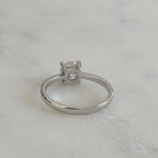 SOLITAIRE LOW PROFILE 4-PRONG ROUND-CUT MOISSANITE RING - 1.0ct
