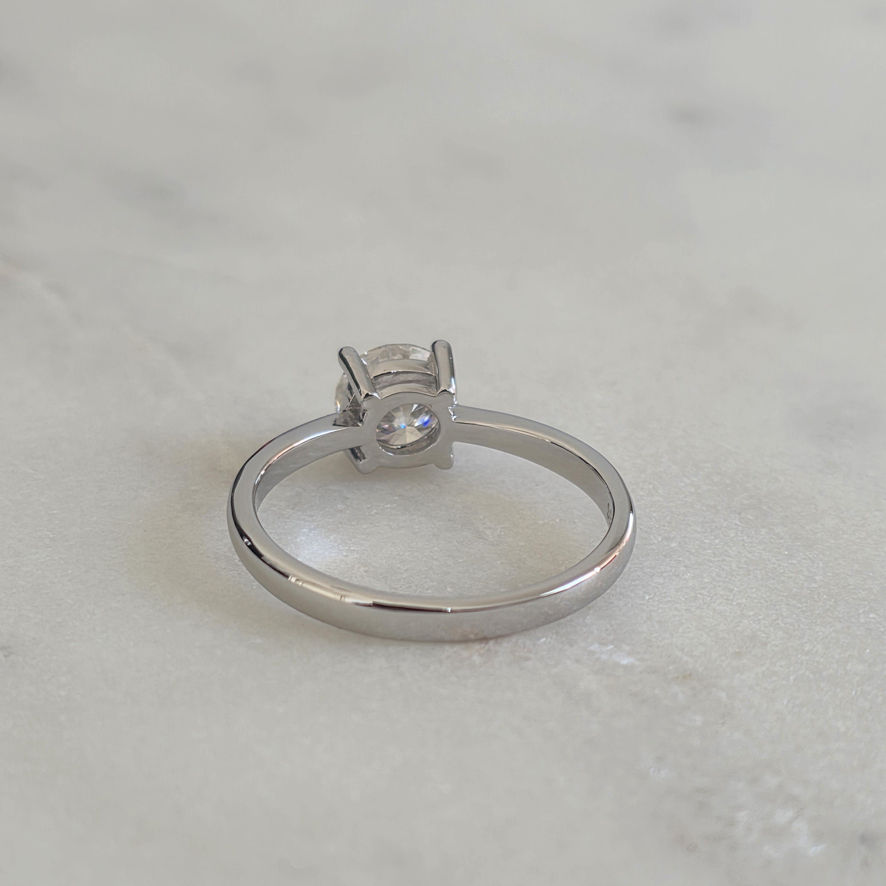 SOLITAIRE LOW PROFILE 4-PRONG ROUND-CUT MOISSANITE RING - 1.0ct