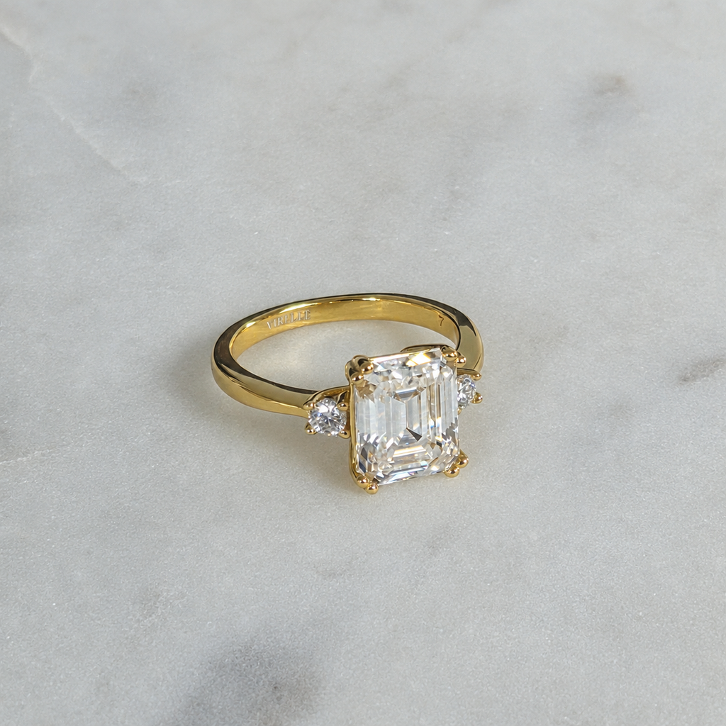 THREE-STONE EMERALD-CUT MOISSANITE RING - 4.4ct
